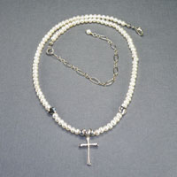 Sterling Silver
              Fresh Water Pearl
              Child's Cross 14" $30